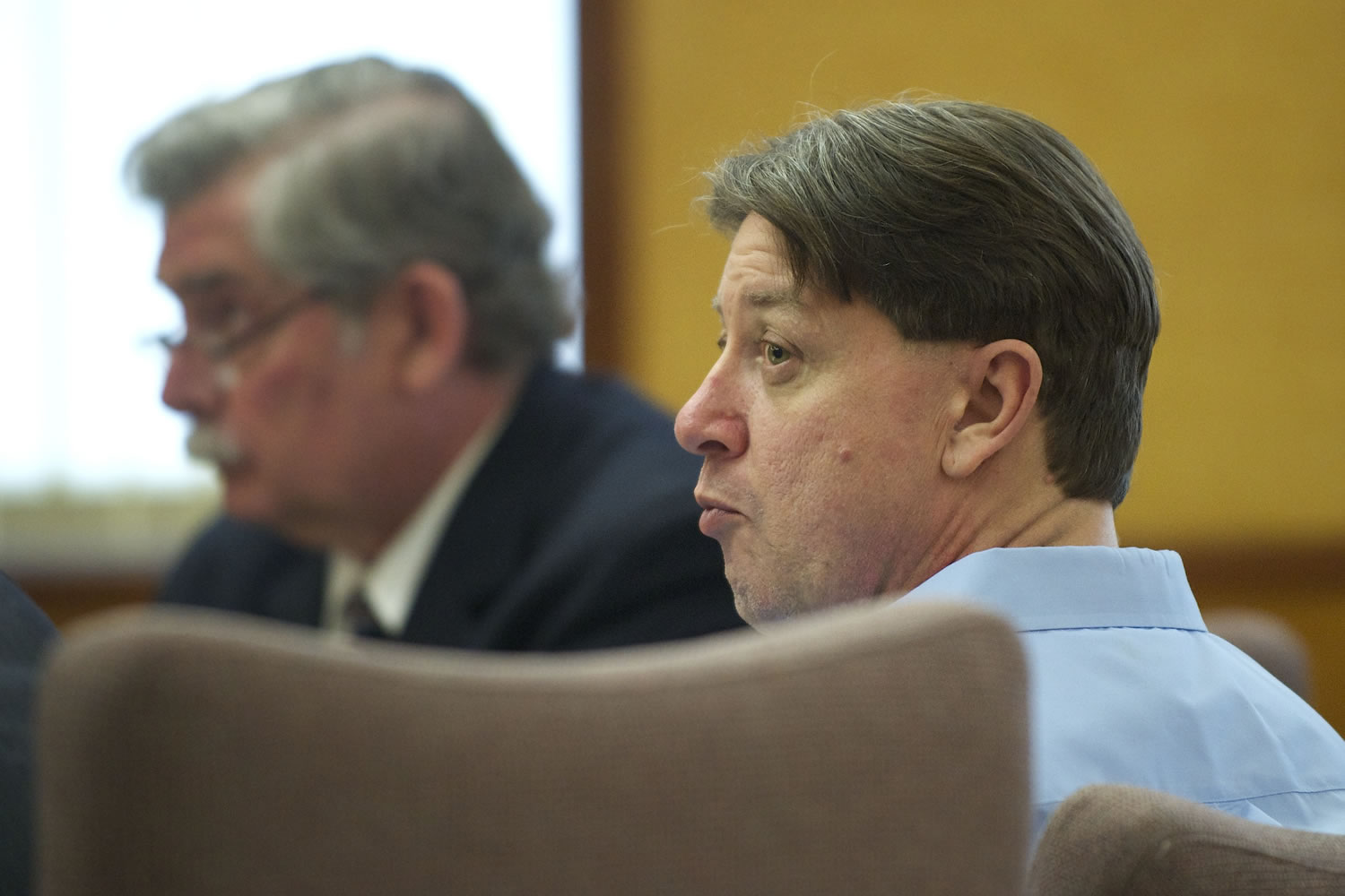 Dennis Wolter of Vancouver listens to attorneys during his trial on a charge of aggravated first-degree murder in the slaying of his girlfriend, Kori Fredericksen.