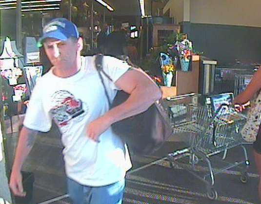 A man identified by Safeway as Rick Clark leaves the Safeway store in downtown Vancouver with $380.92 in whiskey and cognac around 8 p.m. on July 21, 2012.