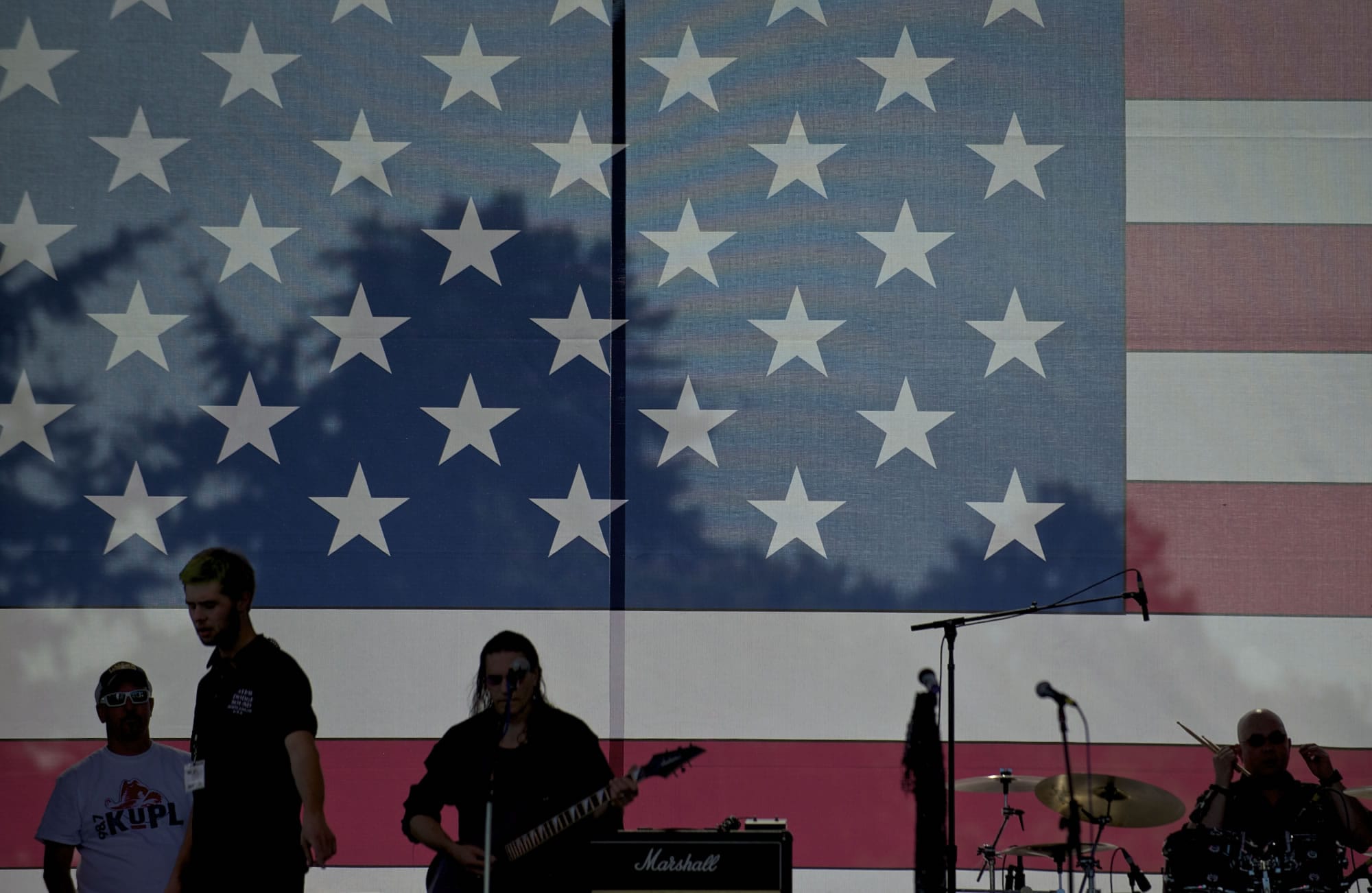 Nu Wave Machine takes the stage and prepares to start their set during the Fourth of July celebration at Fort Vancouver on Wednesday.