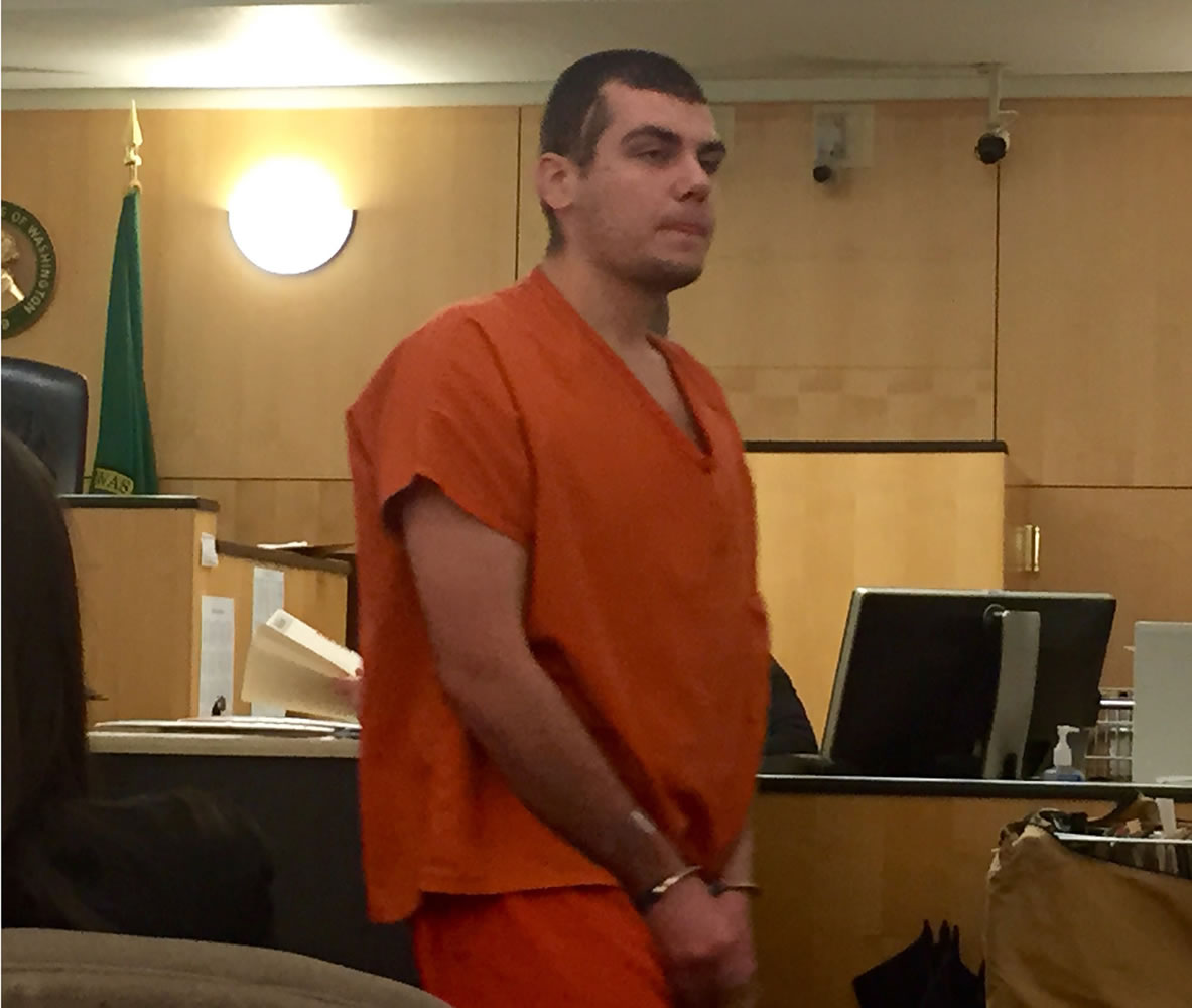 Dmitriy Gernega, 22, makes a first appearance Friday in Clark County Superior Court after allegedly robbing a Vancouver Cascade Federal Credit Union at gunpoint twice in April 2014.