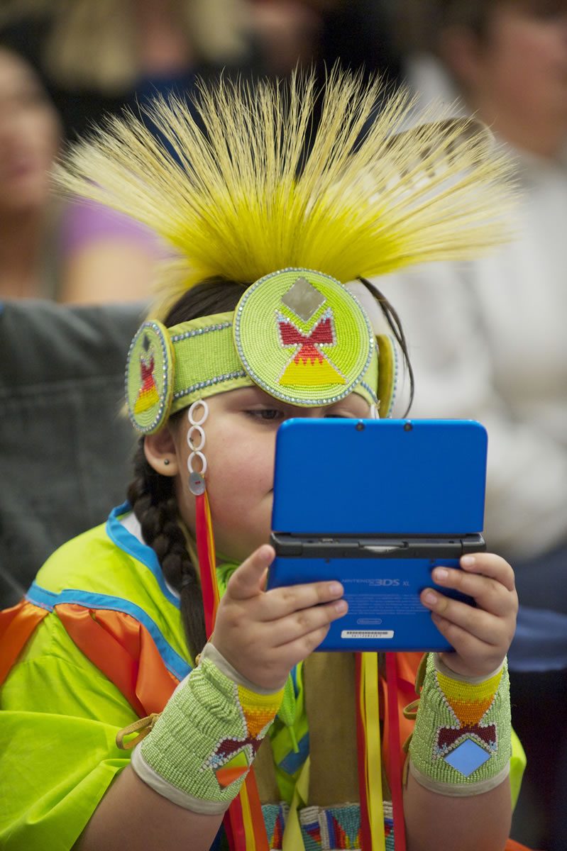 Sun Hawk Thomas, 6, Mid-Columbia River Brave, waits for the Grand Entry Saturday at the Title VII Native American Indian Education Program's annual pow-wow at Covington Middle School in Vancouver.
