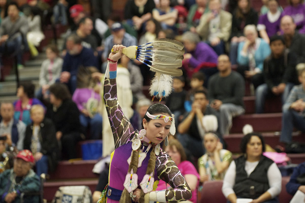 Keeli Little Leaf, 18, of Warm Springs, Ore., performs a jingle dance Saturday at the Title VII Native American Indian Education Program's annual pow-wow at Covington Middle School in Vancouver.