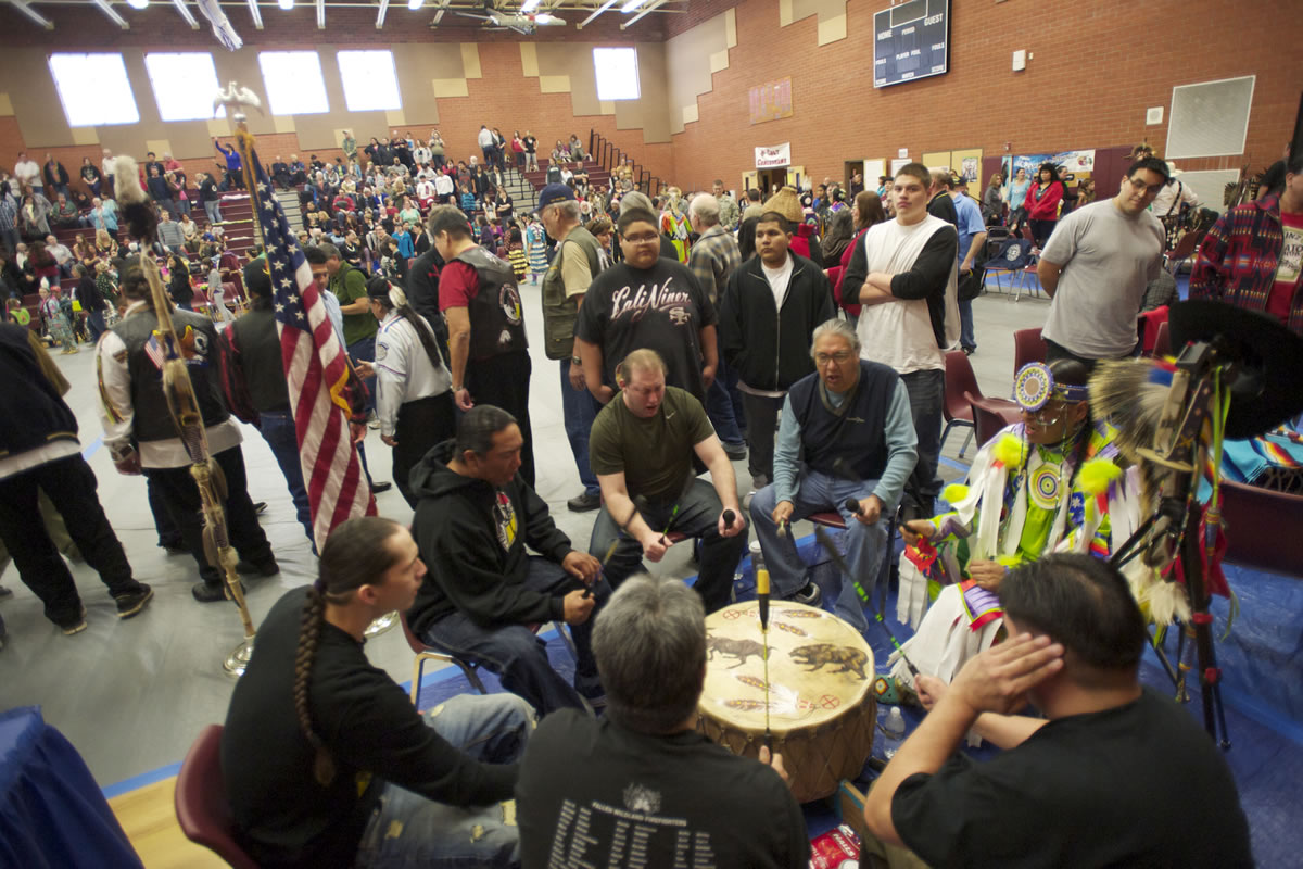 The Bulls and Bears Drum Group perform an honor song Saturday at the Title VII Native American Indian Education Program's annual pow-wow at Covington Middle School in Vancouver.