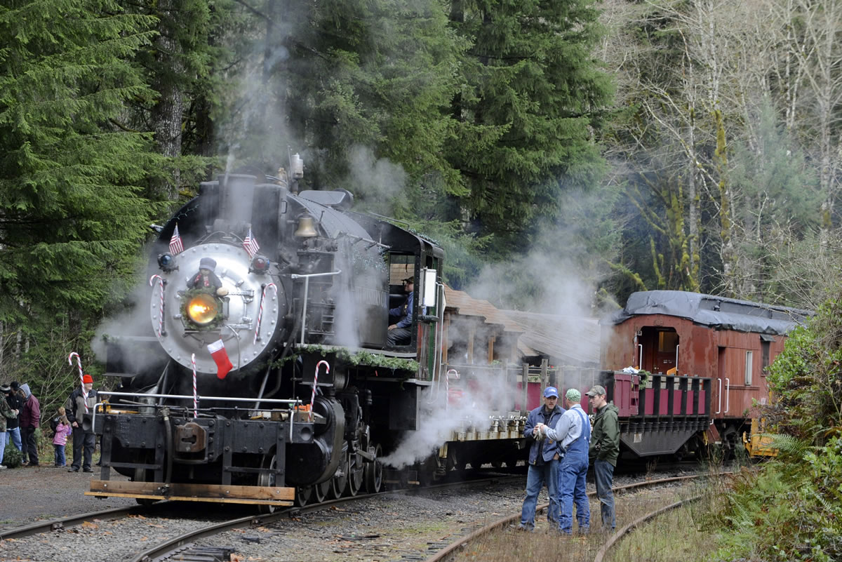 Engineers take a break at the stop on the Chelatchie Prairie Steam Railroad in Yacolt Wa, Saturday Dec 19, 2015.