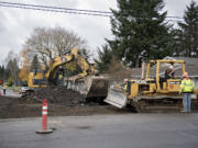 Construction crews work near the intersection of Northeast 94th Avenue and Northeast 96th Street on Nov. 24, 2015.