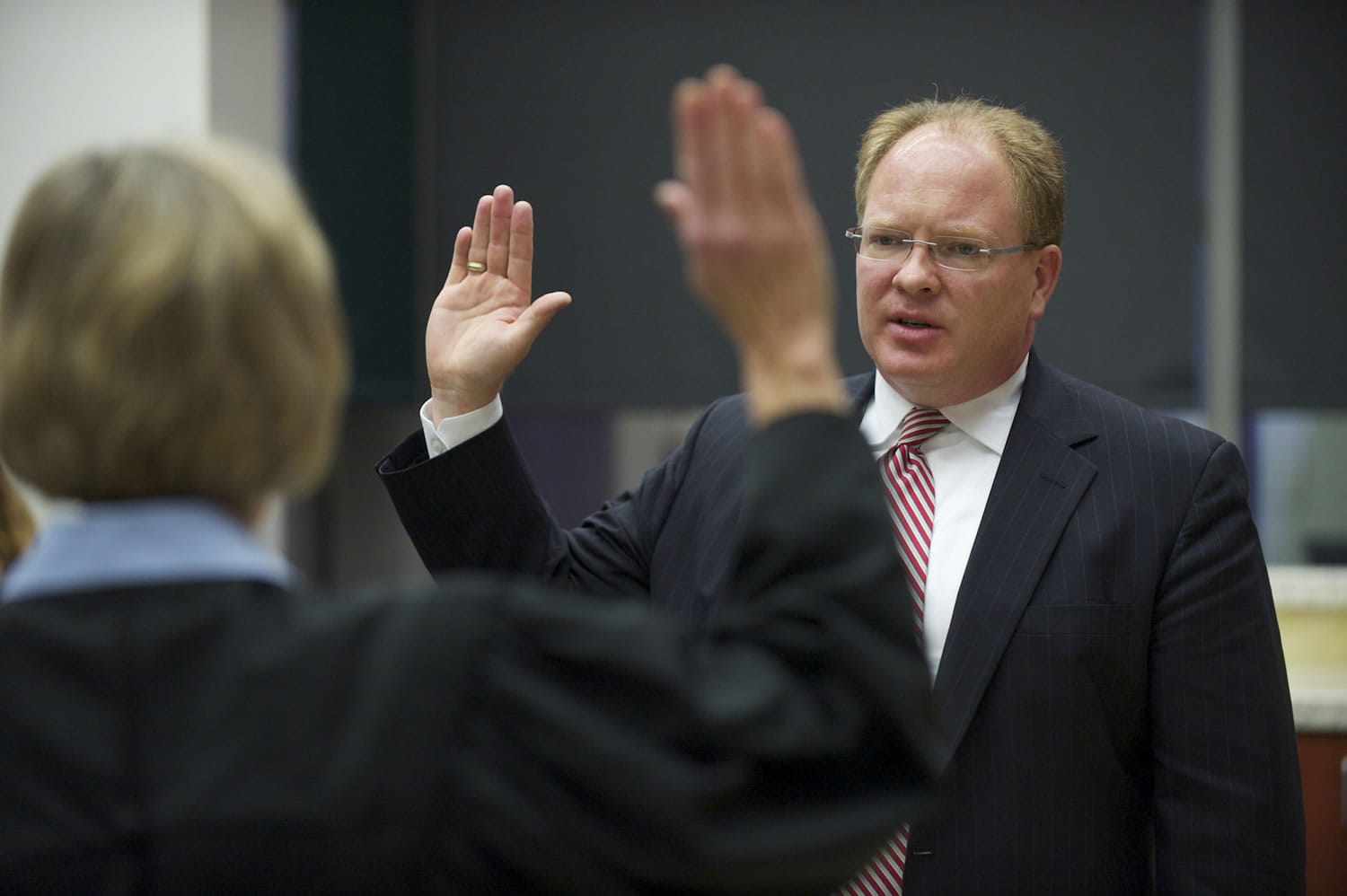 Clark County Superior Court Judge David Gregerson takes the oath of office from Judge Barbara Johnson during his swearing-in ceremony Monday at the Clark County Public Service Center.