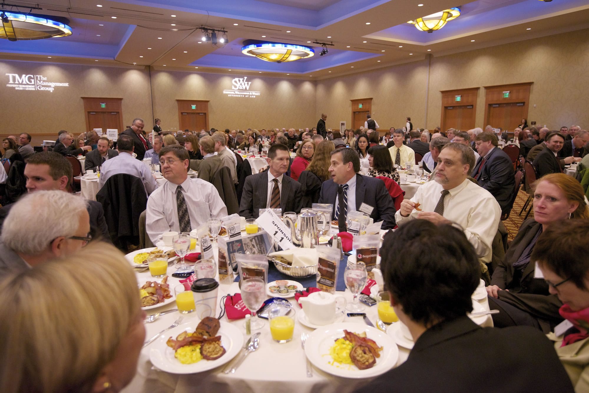 Participants talk and enjoy breakfast before the start of the 2013 Economic Forecast Breakfast this morning.