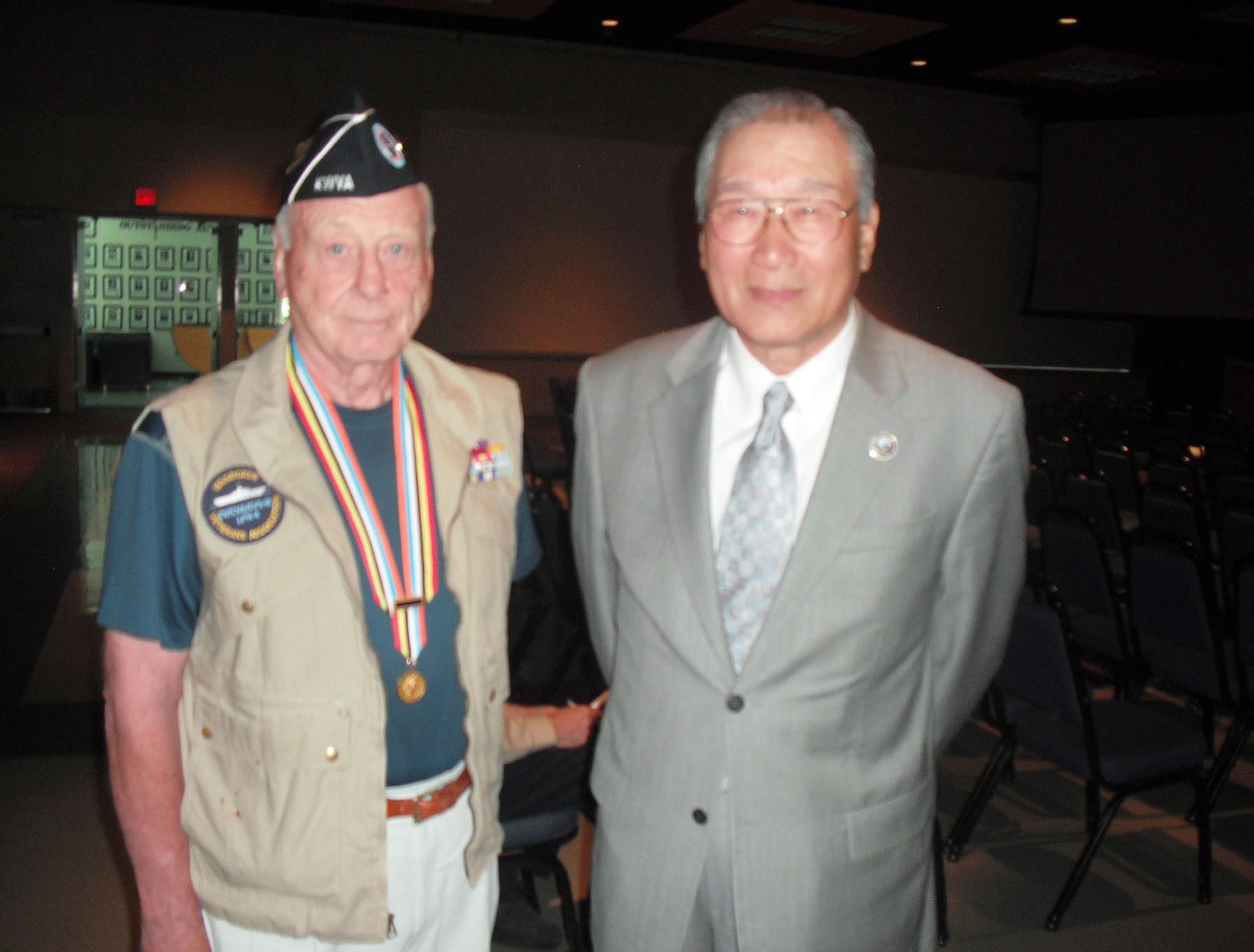 Harold Olson, left, first vice commander of the local Korean War Veterans group, with Woong Kyu Cho, chairman of the Korea-America Society.