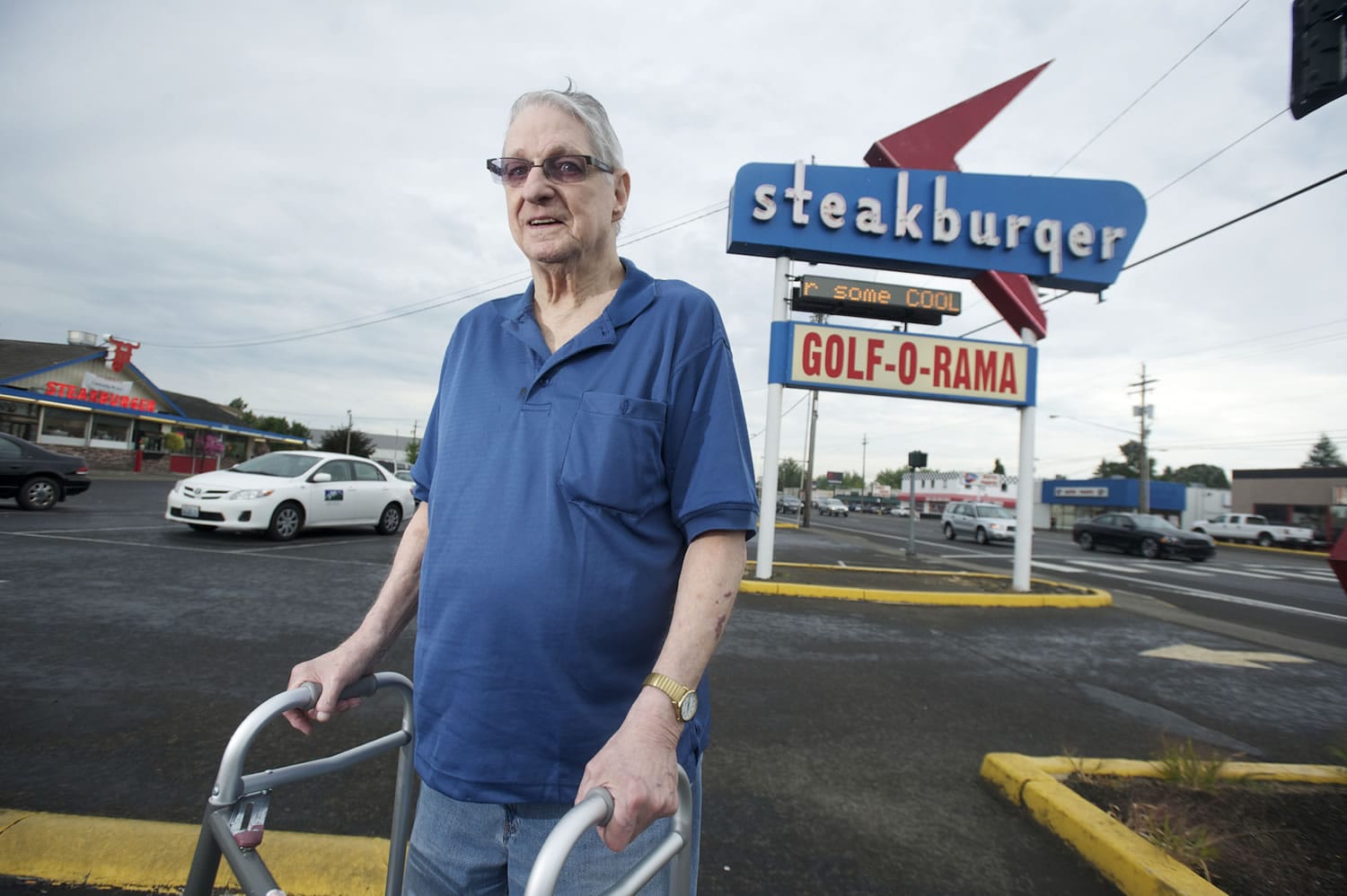Bud Van Cleve, longtime president of the Northeast Hazel Dell Neighborhood Association, stands in front of the Hazel Dell landmark Steakburger restaurant on Highway 99.