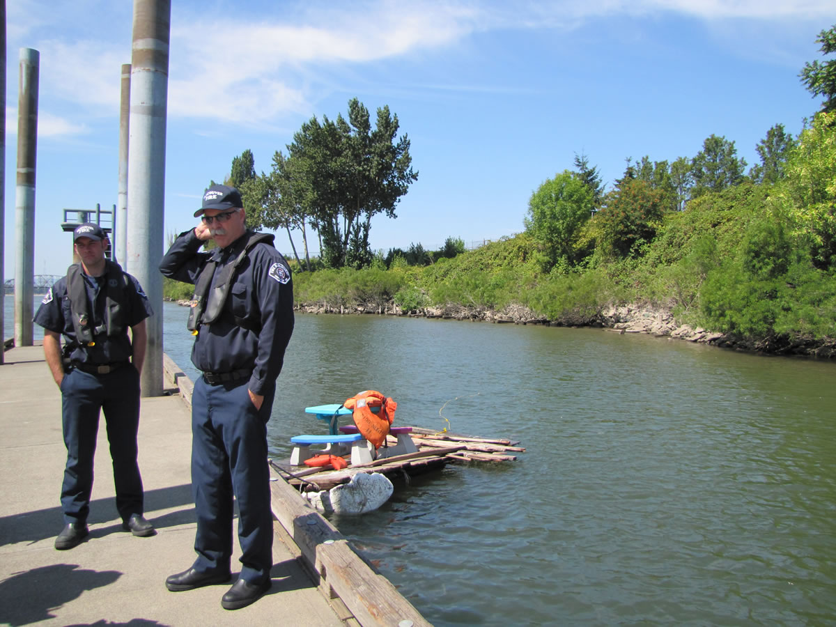 Vancouver firefighters Jason Hathaway, left, and Kevin Murray emphasized safety Monday after rescuing two teens Sunday from this makeshift raft on the Columbia River.