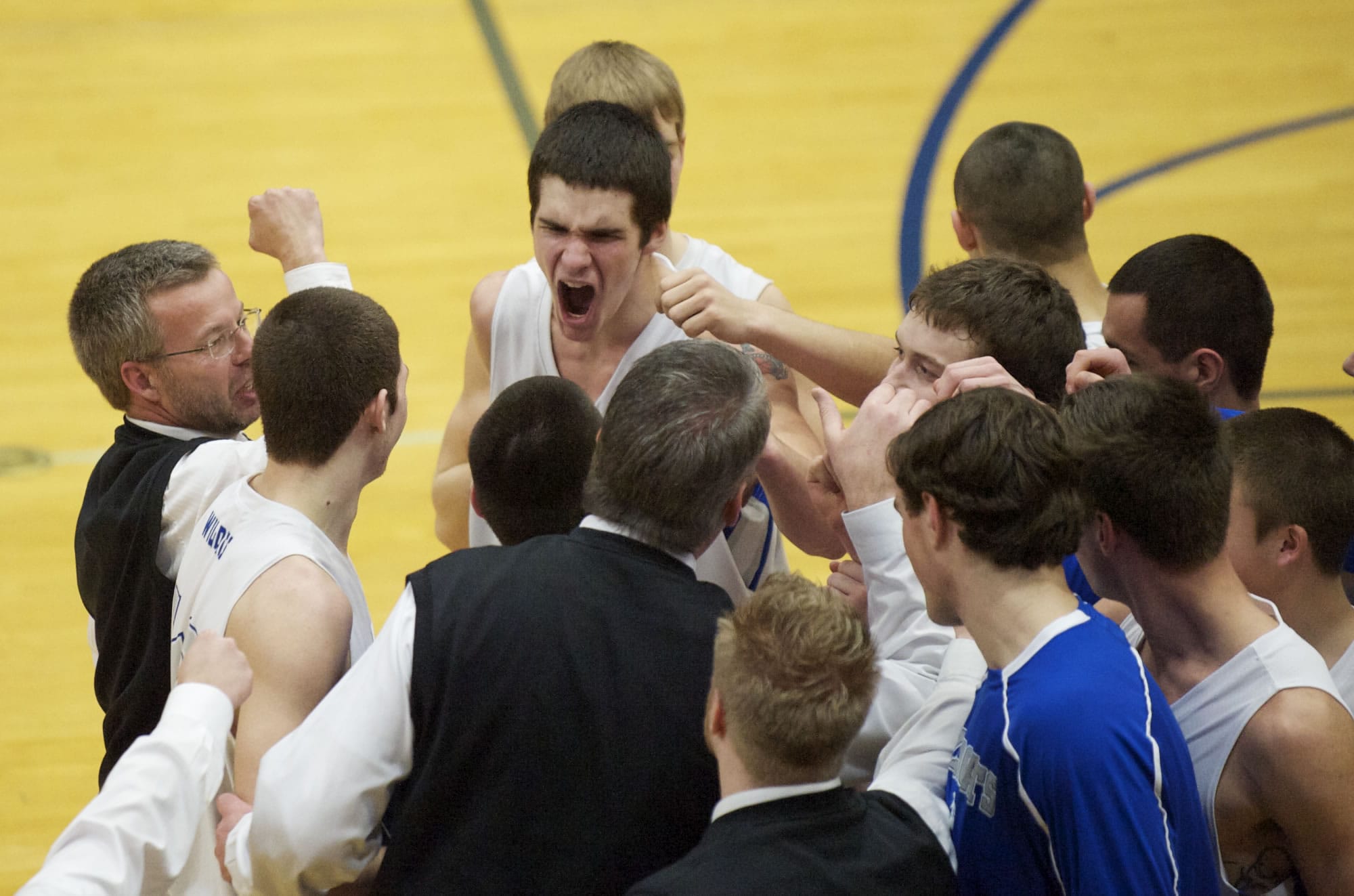 La Center's Austin Meyers celebrates with his team after beating Woodland at the boys 1A District Tournament at Kelso High School, Wednesday, February 13, 2013.