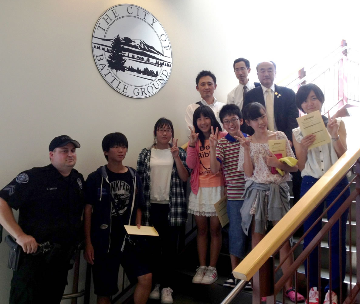 Battle Ground: A delegation of visitors from Gosen, Japan, including the mayor and six students, tours the Battle Ground Police Department on Aug.
