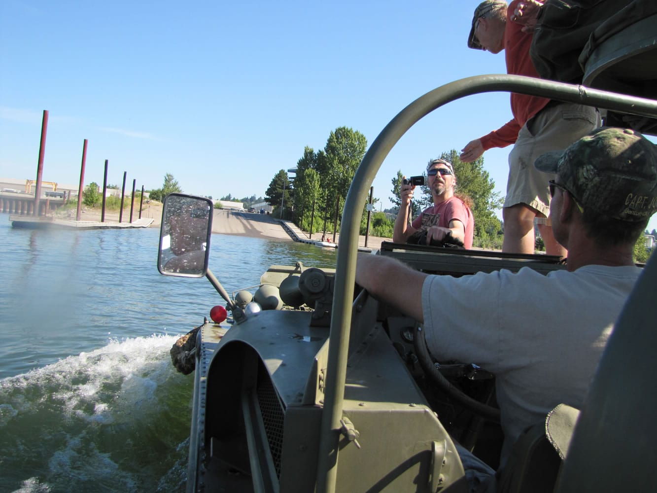John Engelke pilots his World War II amphibious vehicle toward the Marine Park boat landing Wednesday morning after giving a ride to several people who watched his DUKW arrive in Vancouver.