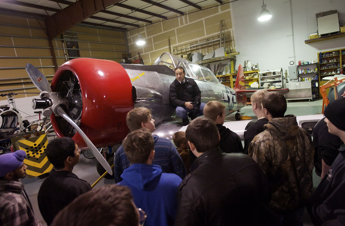 Pearson Air Museum director Laureano Mier tells students in David Richards' metal-fab class at Fort Vancouver High School how career training can pay off in the working world.
