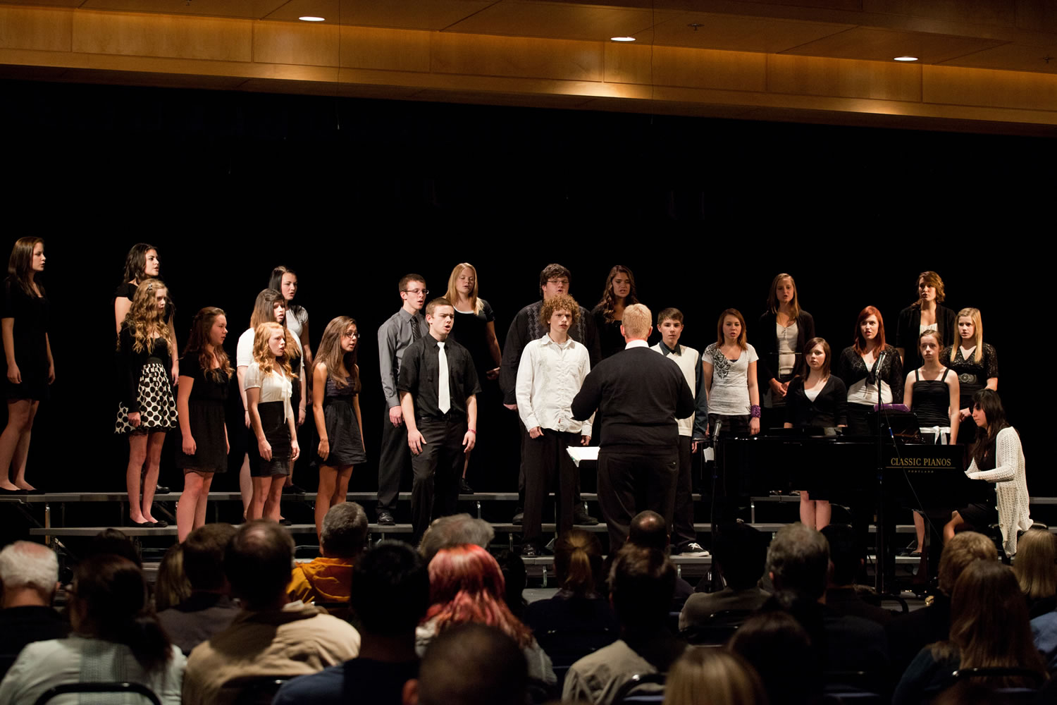 Central Park -- The Woodland High School Concert Choir performs under the direction by Brent LiaBraaten, center, at Clark College's Fall Choral Festival on Nov.