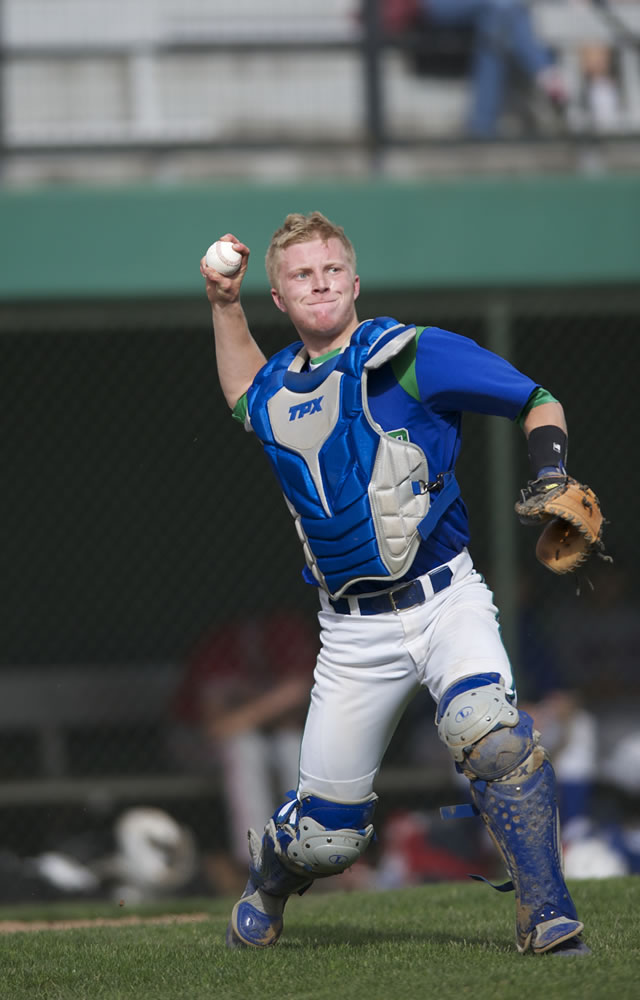 National League catcher Greg Ryan of Mountain View throws to first base for the final out of the sixth inning during the first of Wednesday's two games at Propstra Stadium.