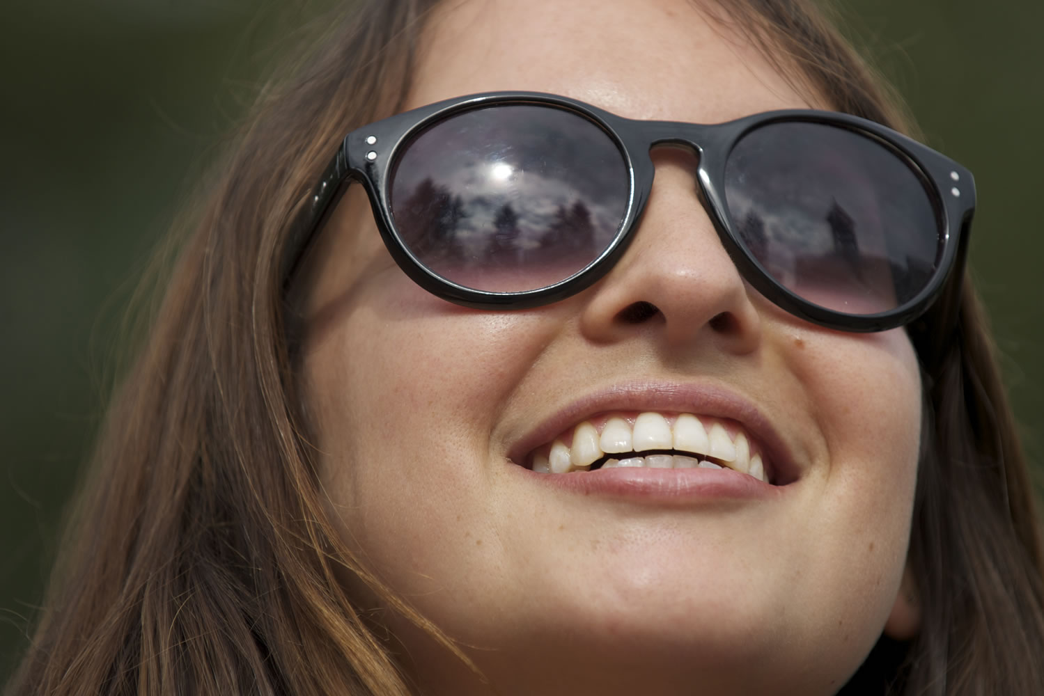 Olivia Orozco of Brooklyn, N.Y., models her sunglasses while in Esther Short Park in Vancouver on Wednesday.