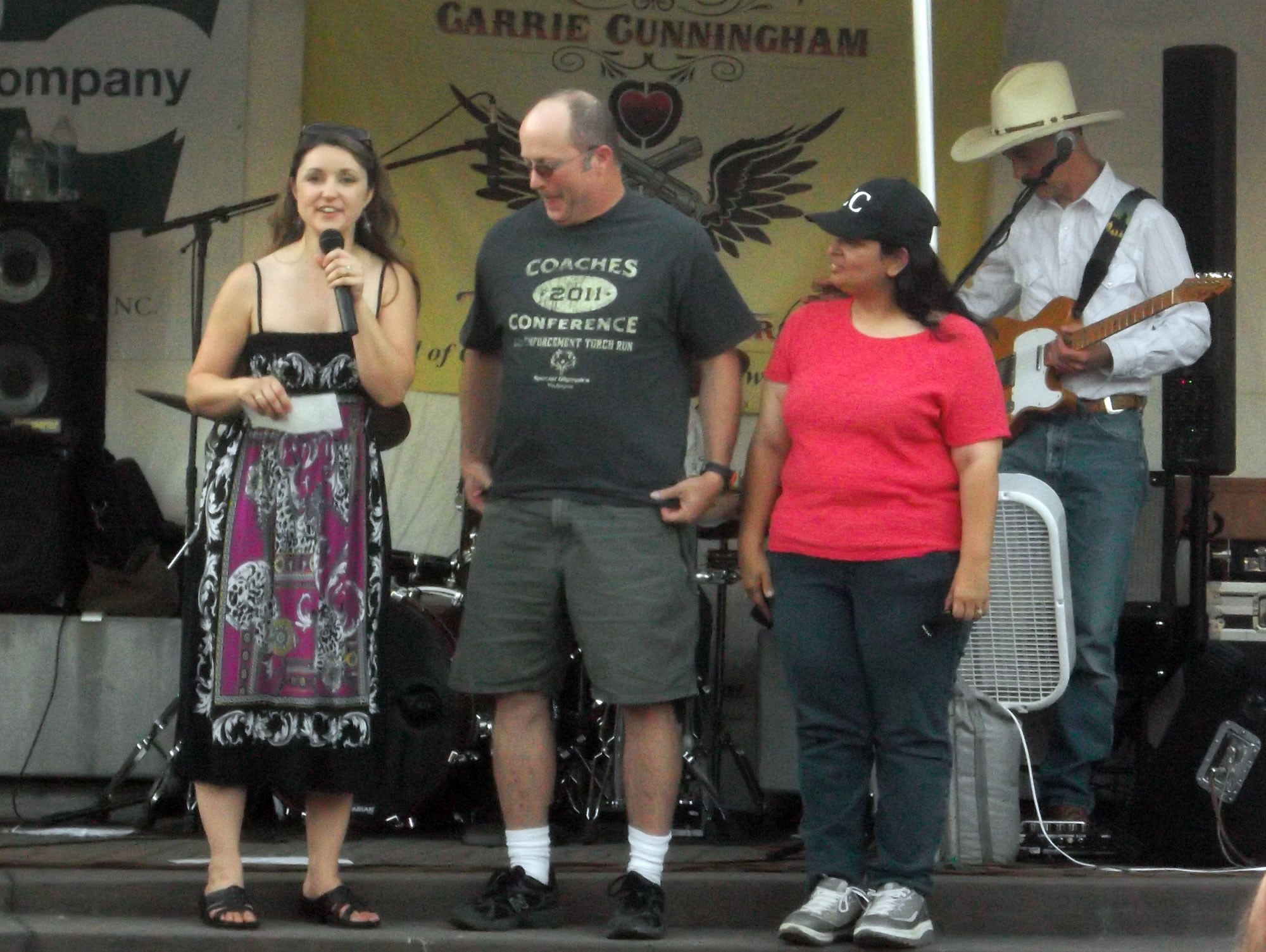 Washougal: Country crooner Carrie Cunningham passes along a donation to Rick Cook and Elizabeth Francis of Clark County Special Olympics.