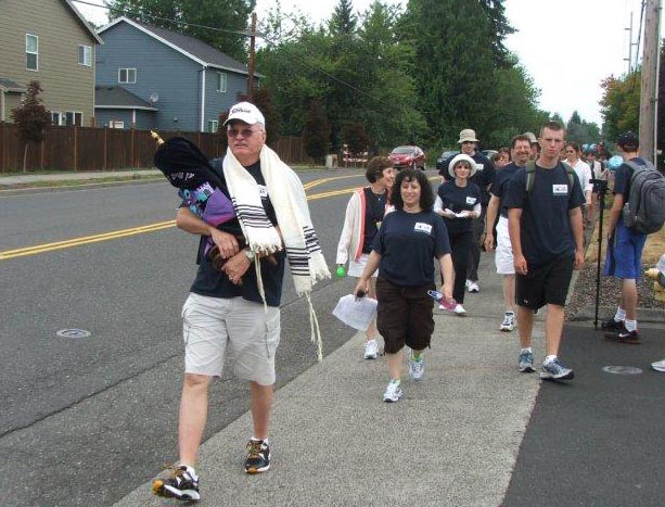 Glenwood: Jack Litman, from left, Rabbi Elizabeth Dunsker, center, and other members of Congregation Kol Ami walked their Torah from their old rented home in Salmon Creek to their new synagogue on 119th Street.