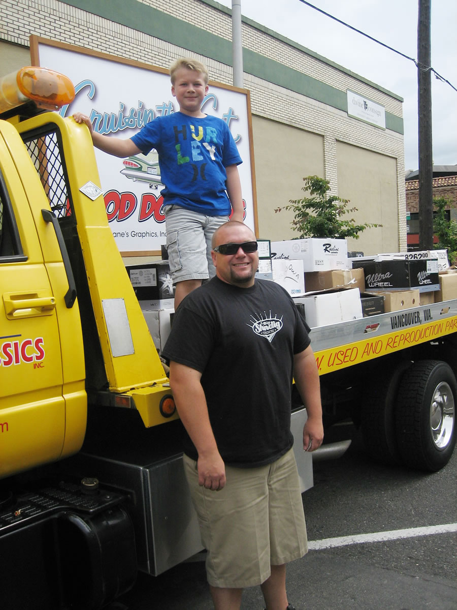 Esther Short: Cruisin' the Gut organizer Phil Medina and son Aiden took 3,345 pounds of donated food to Share.