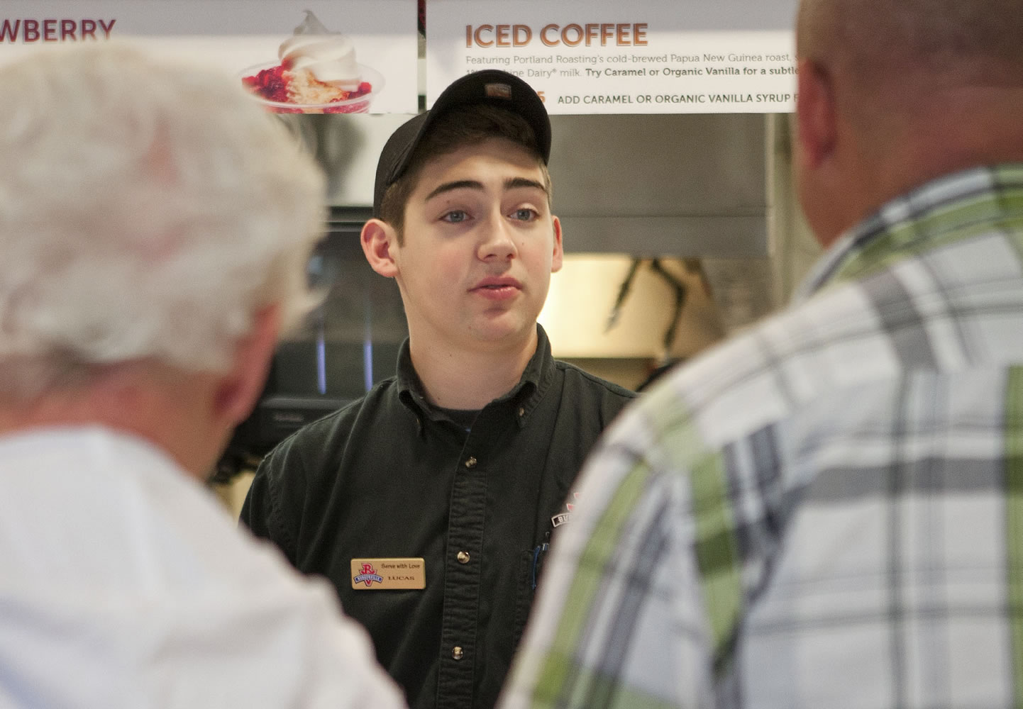 Lucas Schwartz, 17, takes customers' orders at Burgerville in Vancouver.