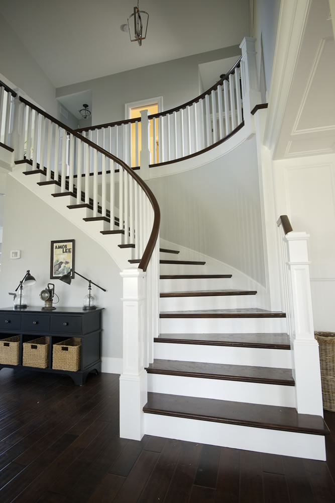 The main entry of The Nantucket, an East Coast-style house, includes a curved staircase that took 14 days to build.