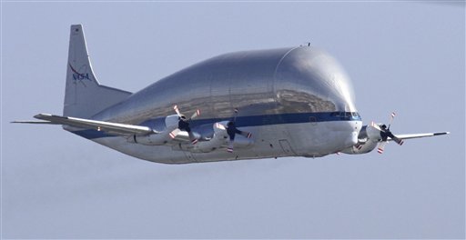 The Super Guppy flies over Seattle Thursday morning, July 26, 2012 about to come in for a landing at Boeing Field