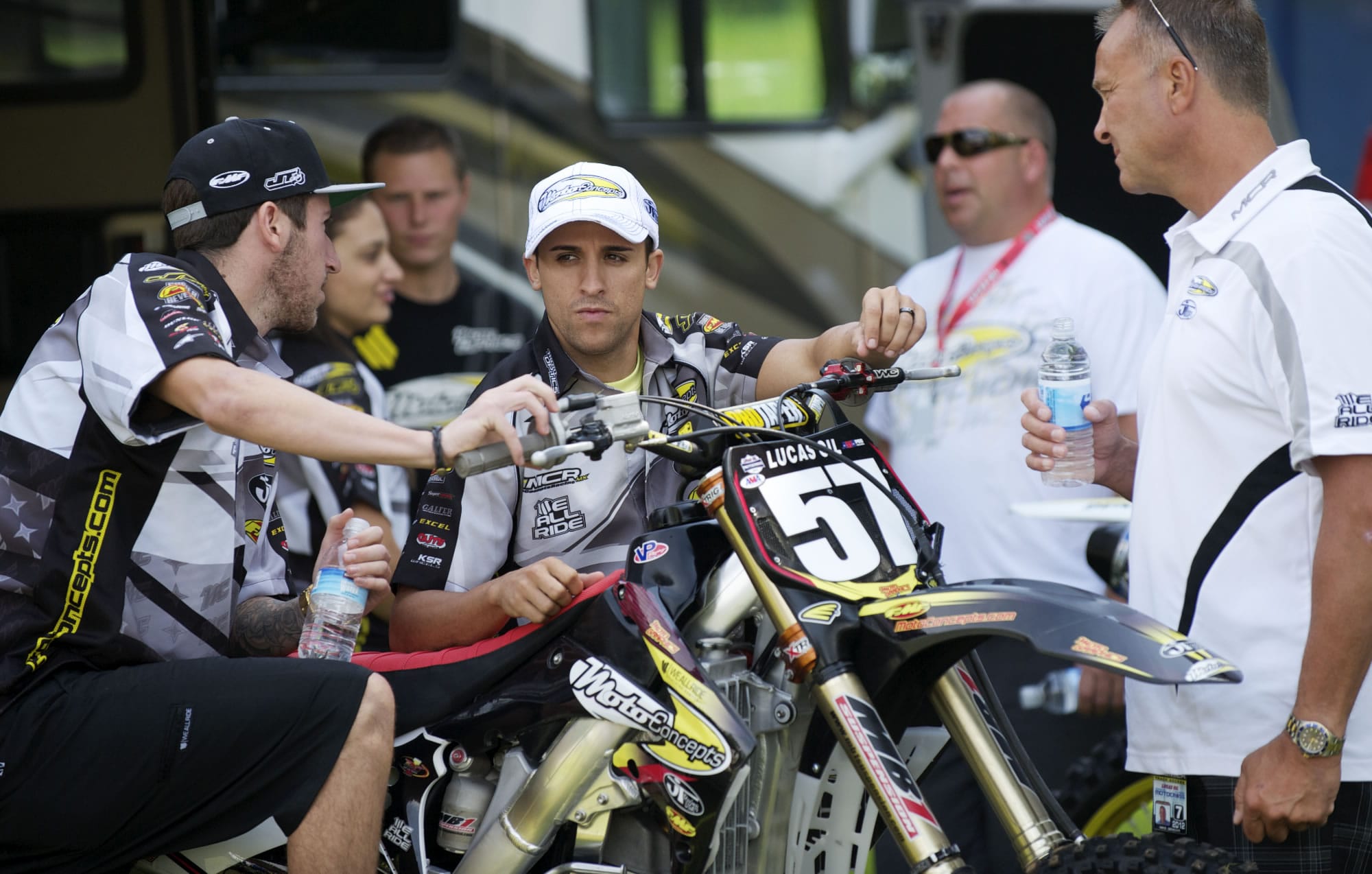 Mike Alessi, center, talks with teammate Jake Canada, left, and team owner Mike Genova prior to Thursday's practice session at Washougal MX Park.