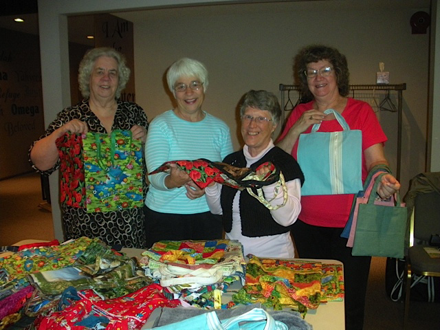 Feilda: Felida: Georgina Cayan, from left, Carrie Campbell, Linda Johnson and Lela Miller   are  sending tote bags out into the wide world.