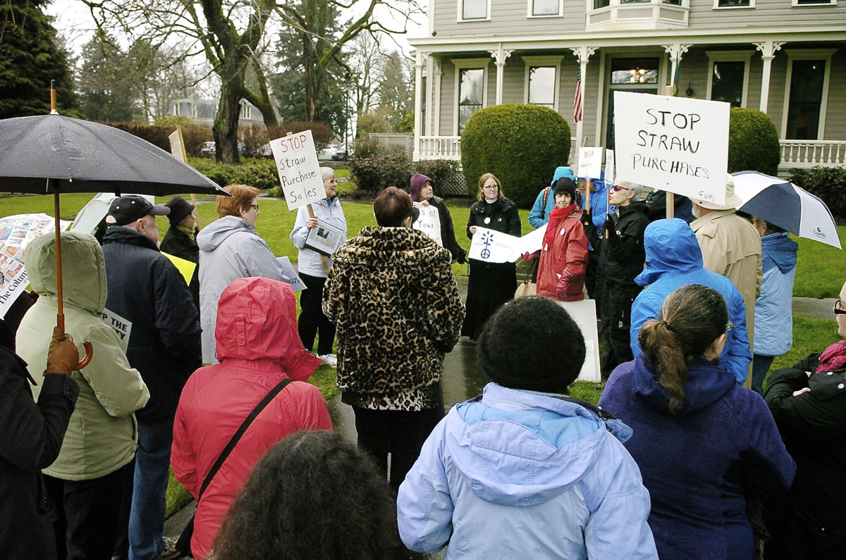 A group of gun-control advocates rally outside the Vancouver office of U.S. Rep. Jaime Herrera Beutler, R-Camas, on Tuesday.