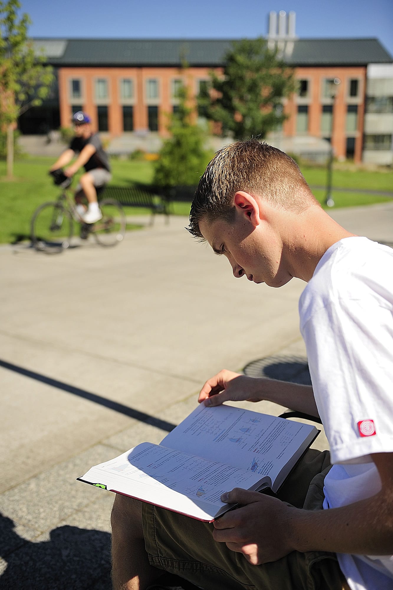 Lason Matson, a freshman from Yacolt, reviews a calculus book after attending his first class in mechanical engineering at Washington State University Vancouver as classes started Monday morning August 23, 2010.