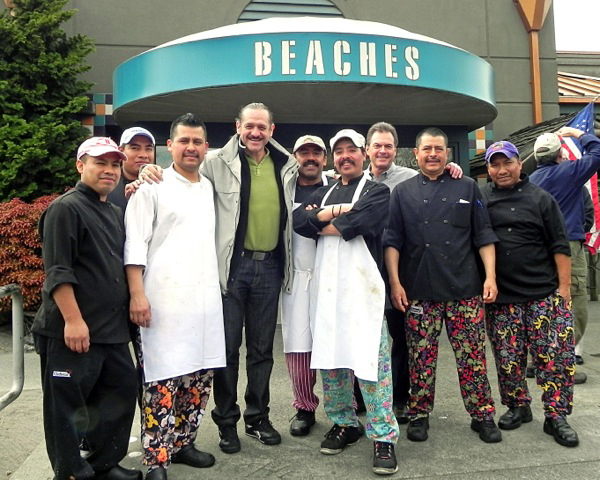 Columbia Way: Popular Mexican comedian Teo Gonzalez, center in coat, poses for photographs during an April visit to Beaches Restaurant. Gonzalez, known for his trademark ponytail, stopped in Vancouver to eat while passing through town on his way to a gig in Seattle.