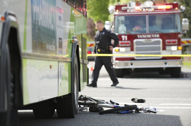 Police investigate an April 28, 2012 accident where a C-Tran bus collided with boy on a bike at the intersection of 27th and Main in Vancouver.