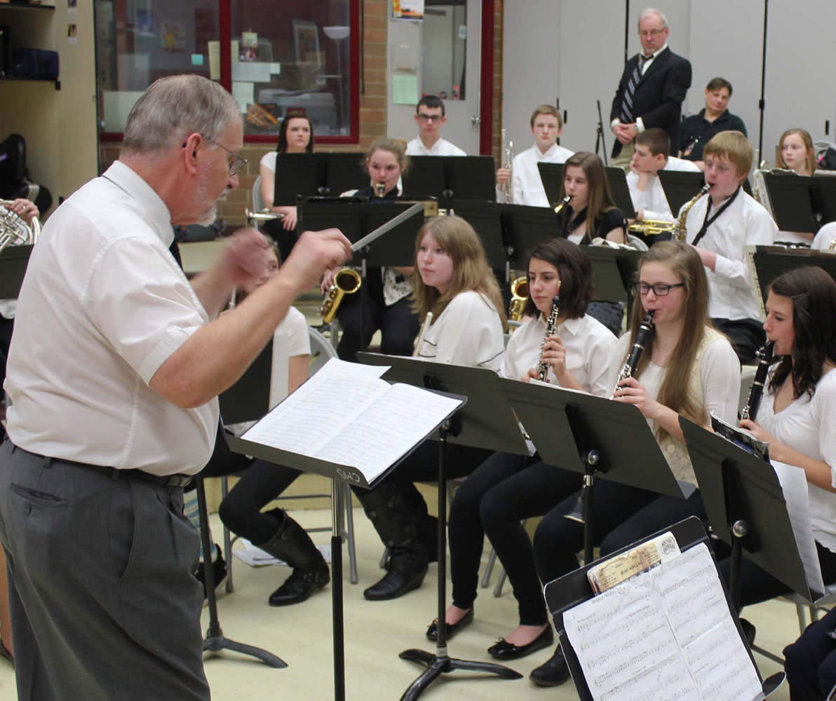 Brush Prairie: Retired music teacher Chuck Bolton, who worked at Sam Barlow High School in Gresham, Ore., conducts a clinic with the Pleasant Valley Middle School band during Battle Ground Public Schools' annual &quot;District Band Day,&quot; held March 7 at Prairie High School.