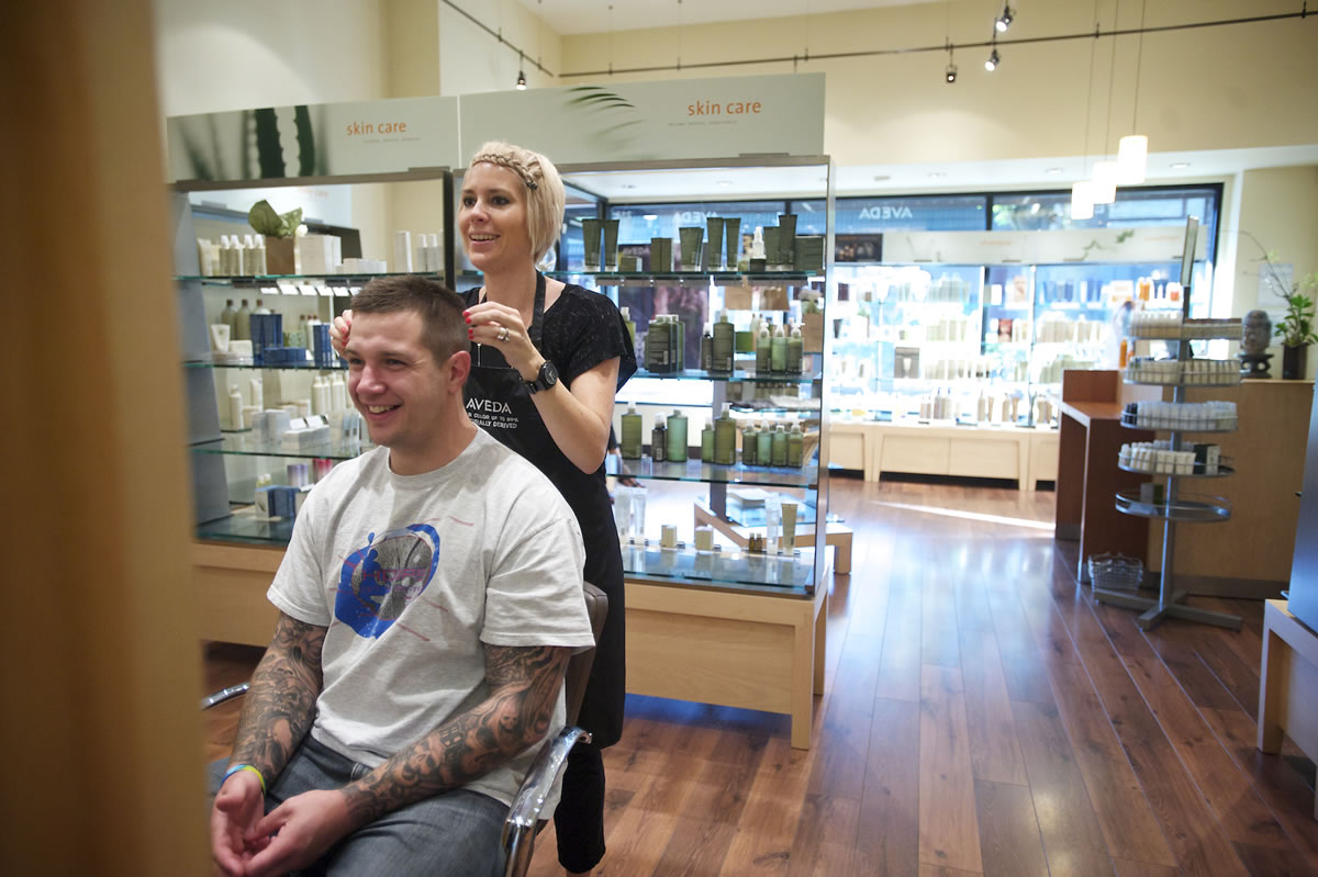 Second Step Housing client Jordan Munday, 30, gushes over his new look provided by stylist Crystal Morgan at Salon Magnolia in Camas.