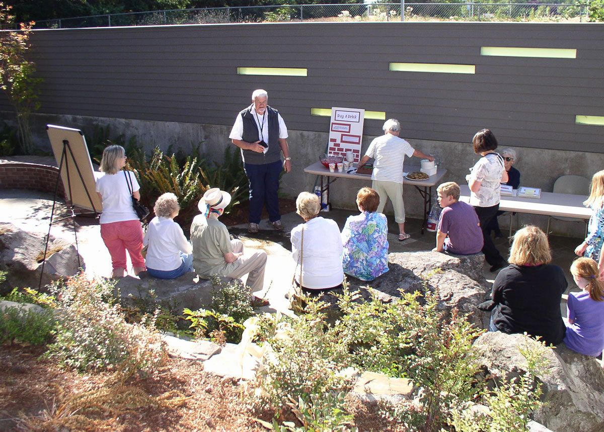Fircrest: Lance Thompson of the Friends of Cascade Park Community Library welcomes guests to a celebration of the finished courtyard landscape.