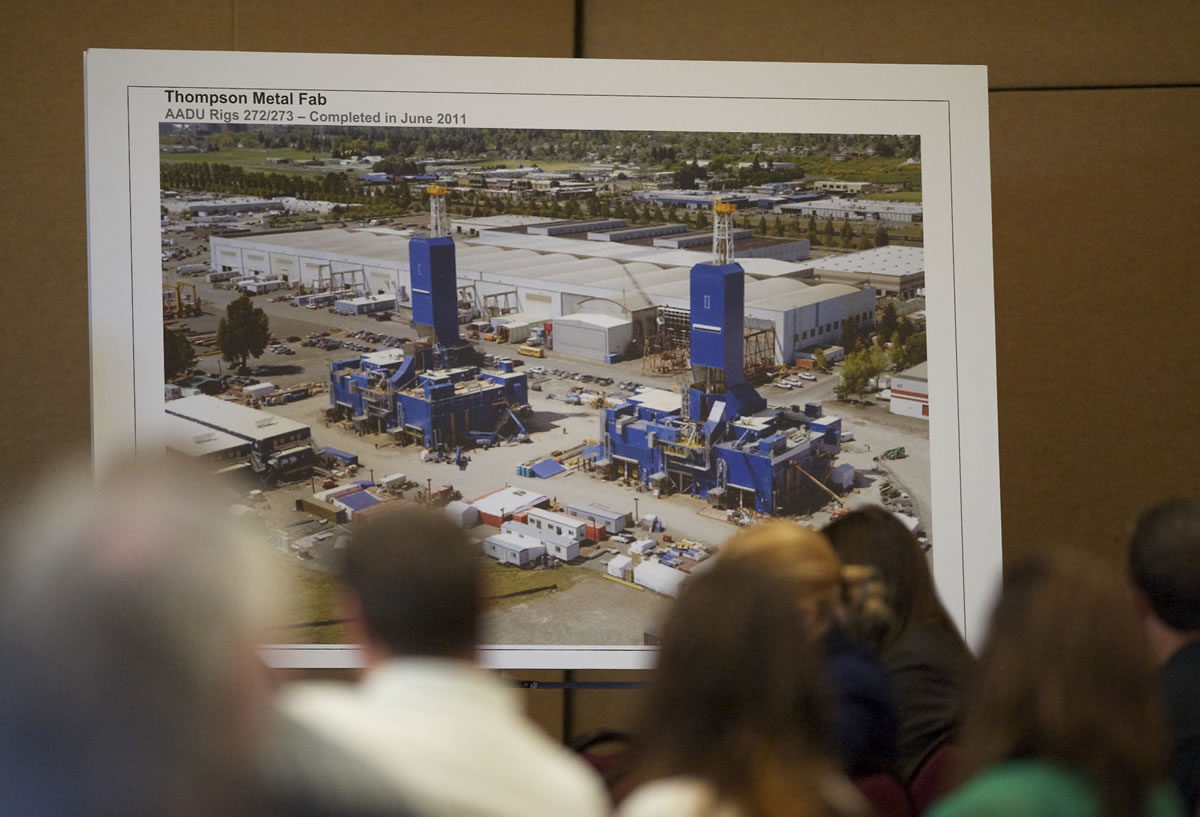 A photograph displayed  at Tuesday's CRC hearing shows oil rigs built by Thompson Metal Fab, which their executives say will be too large to cross underneath the proposed new bridge.