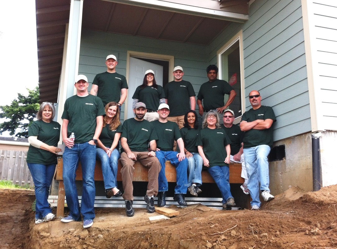 West Minnehaha: Thirteen volunteers from real estate financial firm Walker &amp; Dunlop helped Evergreen Habitat for Humanity add finishing touches to a home on June 19.