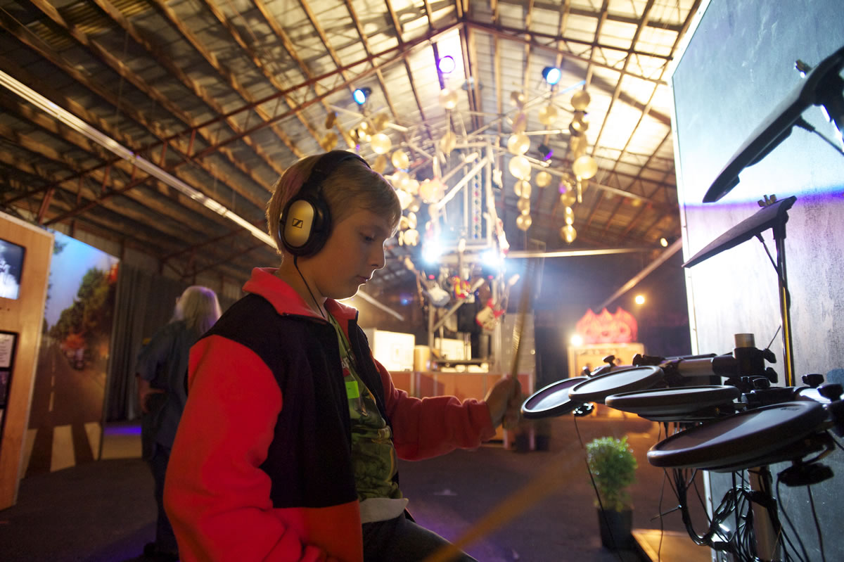 Sebastian Maher, 10, from Vancouver, plays the electric drums at the Rock U exhibit at the Clark County Fair on Friday. Balancing new technology and urban life with agricultural roots is a constant challenge at the Clark County Fair.