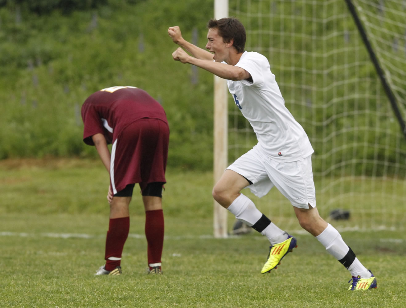 Steve Dipaola/For The Columbian
Ridgefield forward Chase Majury reacts to goal against Kingston during 2A soccer playoff game Wednesday.  Steve Dipaola for the Columbian.