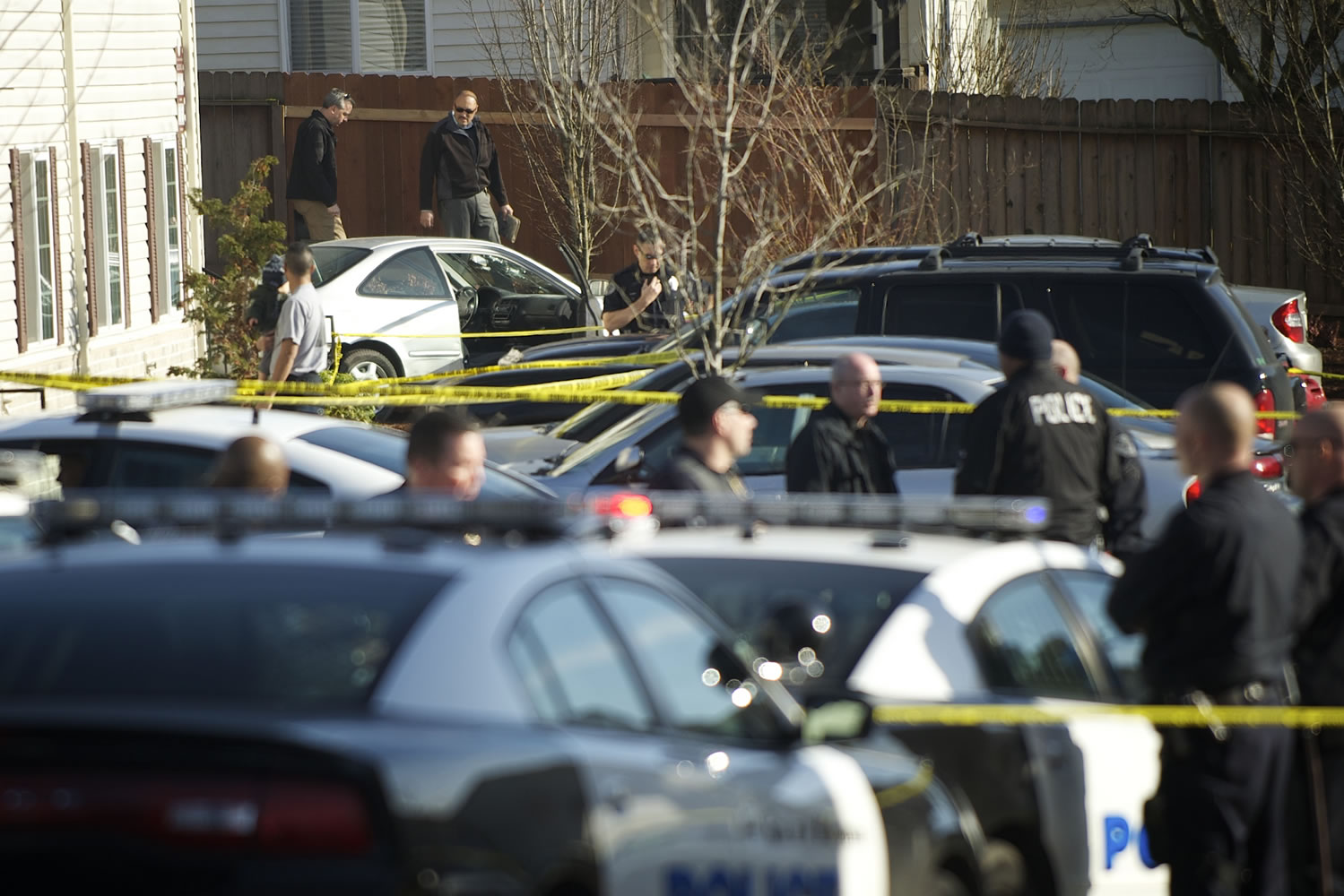 Police investigate a fatal shooting involving undercover police officers Friday January 18, 2013 at the Addison Apartments in Vancouver, Washington.