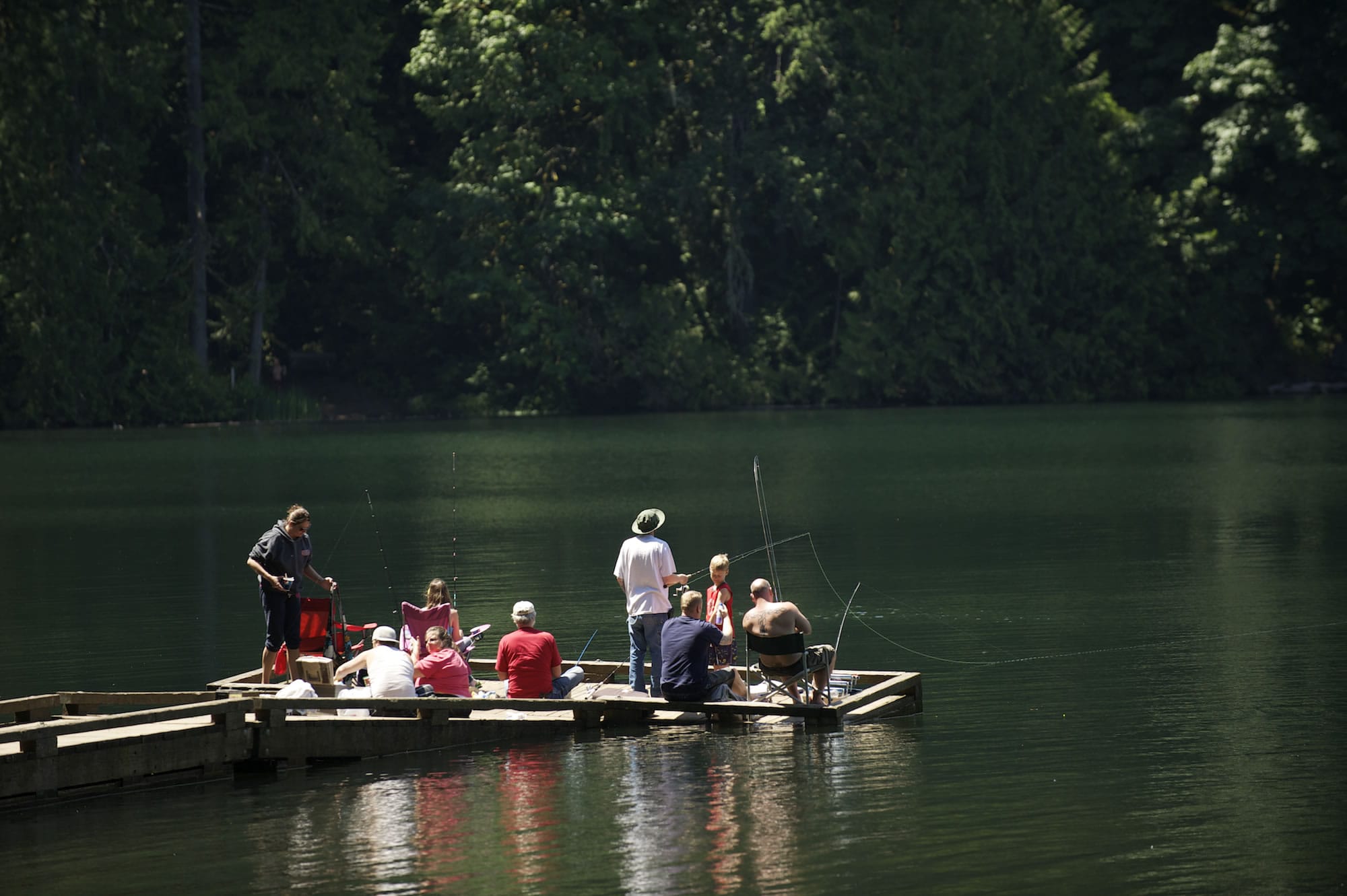 Fishermen fill the dock at Battle Ground Lake State Park on Thursday.