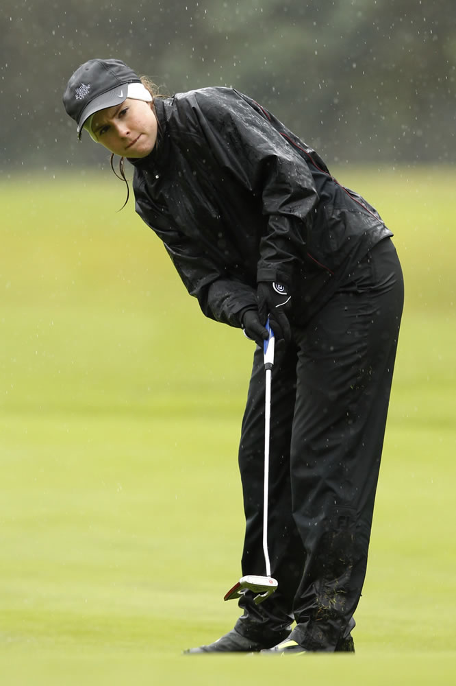 Chloe Bartek of Columbia River High School putts on 10th green at Lewis River Golf Course during the Class 3A girls state championship Wednesday.