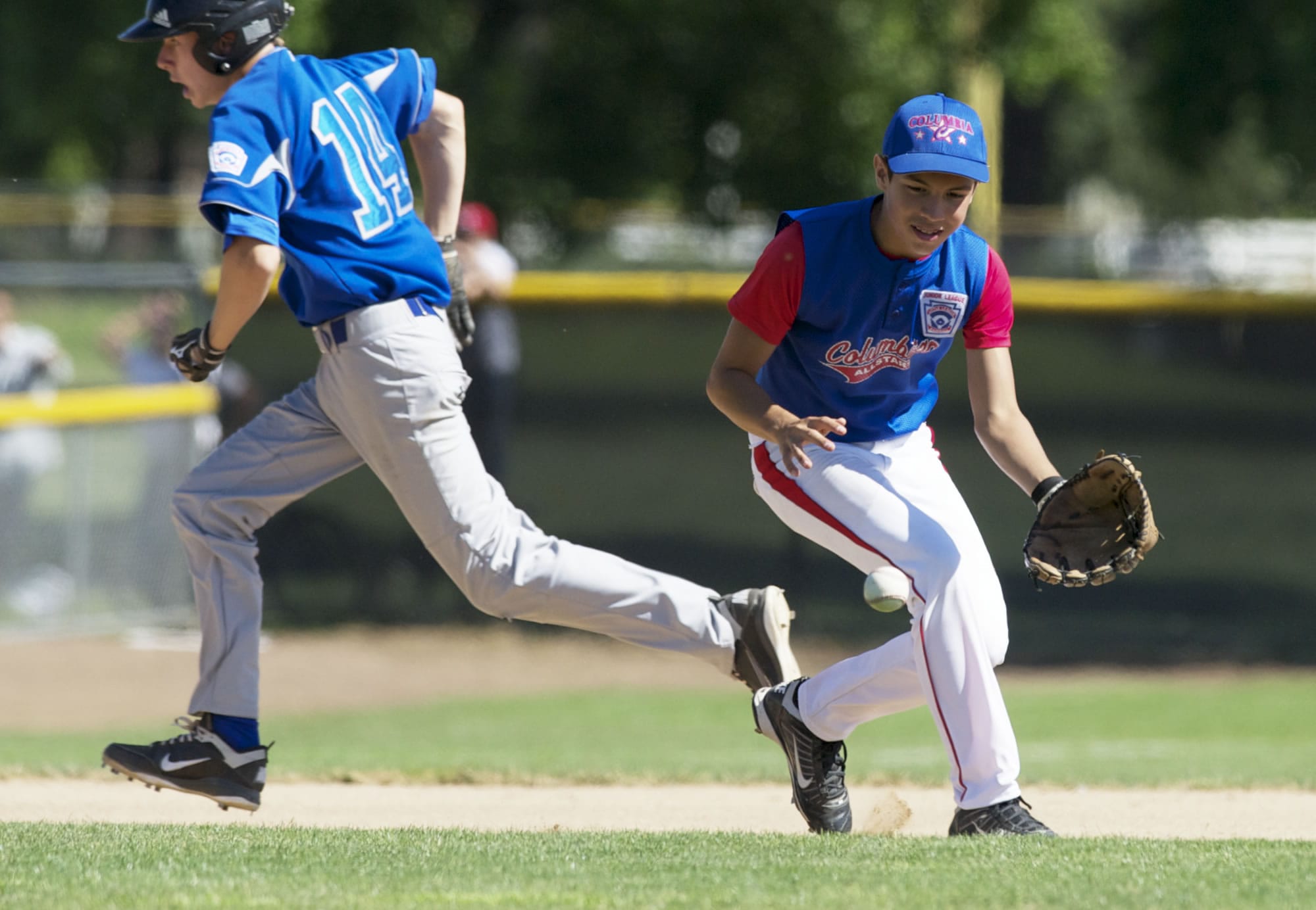 Columbia Little League's Jacob Olivarez fields a ball at third and makes the throw to first for the out against Manhattan Beach in the opening game of the Junior League Western Regional at Propstra Stadium on Tuesday.