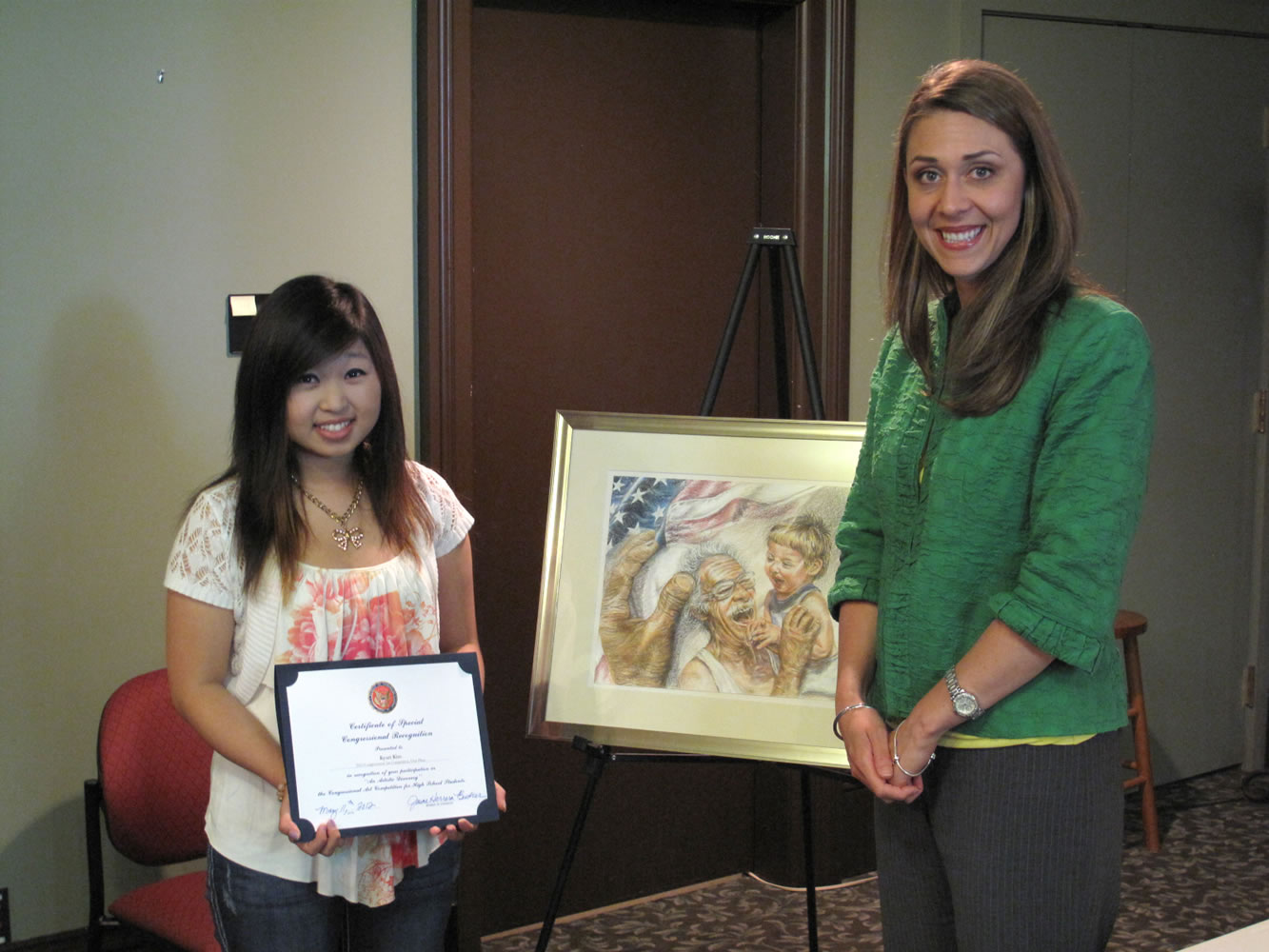 Cascade Park: Mountain View High School student Kyrui Kim, with her prize-winning artwork &quot;Importance of Memories,&quot; stands with U.S. Rep.