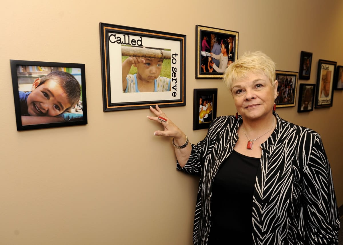 Cyndi Romine, founder of Called to Rescue, shows photos that document her decades of work to rescue children from sex trafficking.