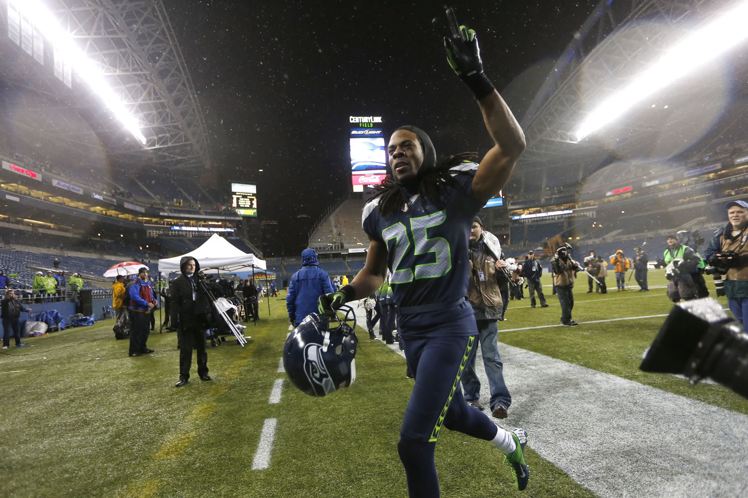 Seattle Seahawks Richard Sherman runs off the field after the Seahawks beat the San Francisco 49ers 42-13 in an NFL football game, Sunday, Dec. 23, 2012, in Seattle.