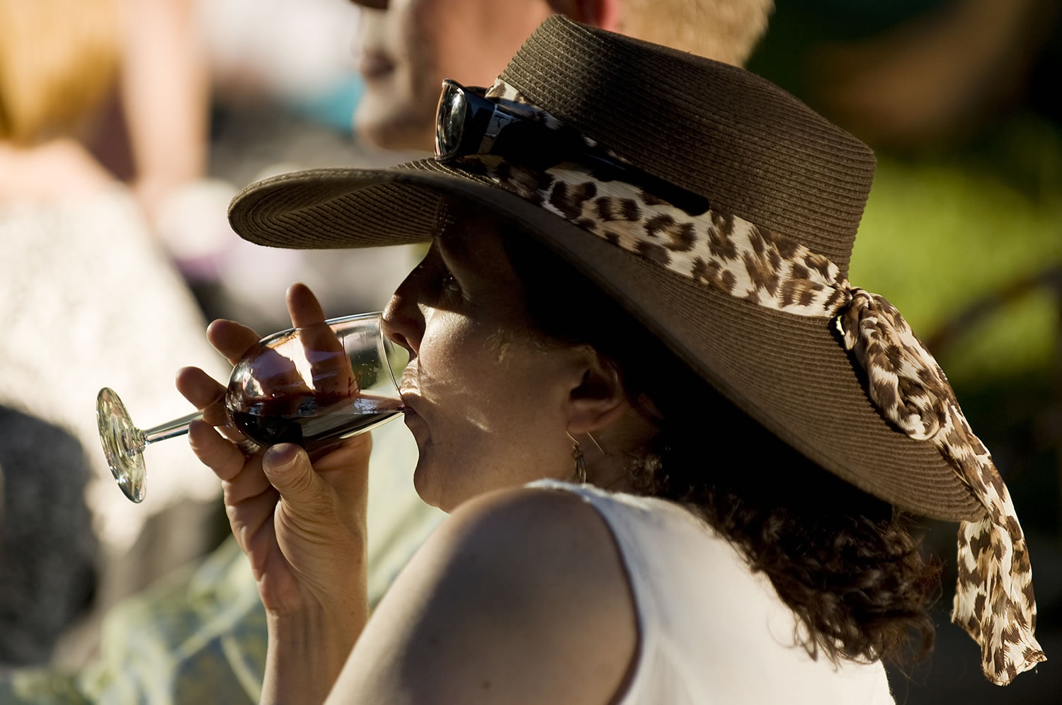 A woman sips wine on the opening night of the 2011 Vancouver Wine and Jazz Festival at Esther Short Park.