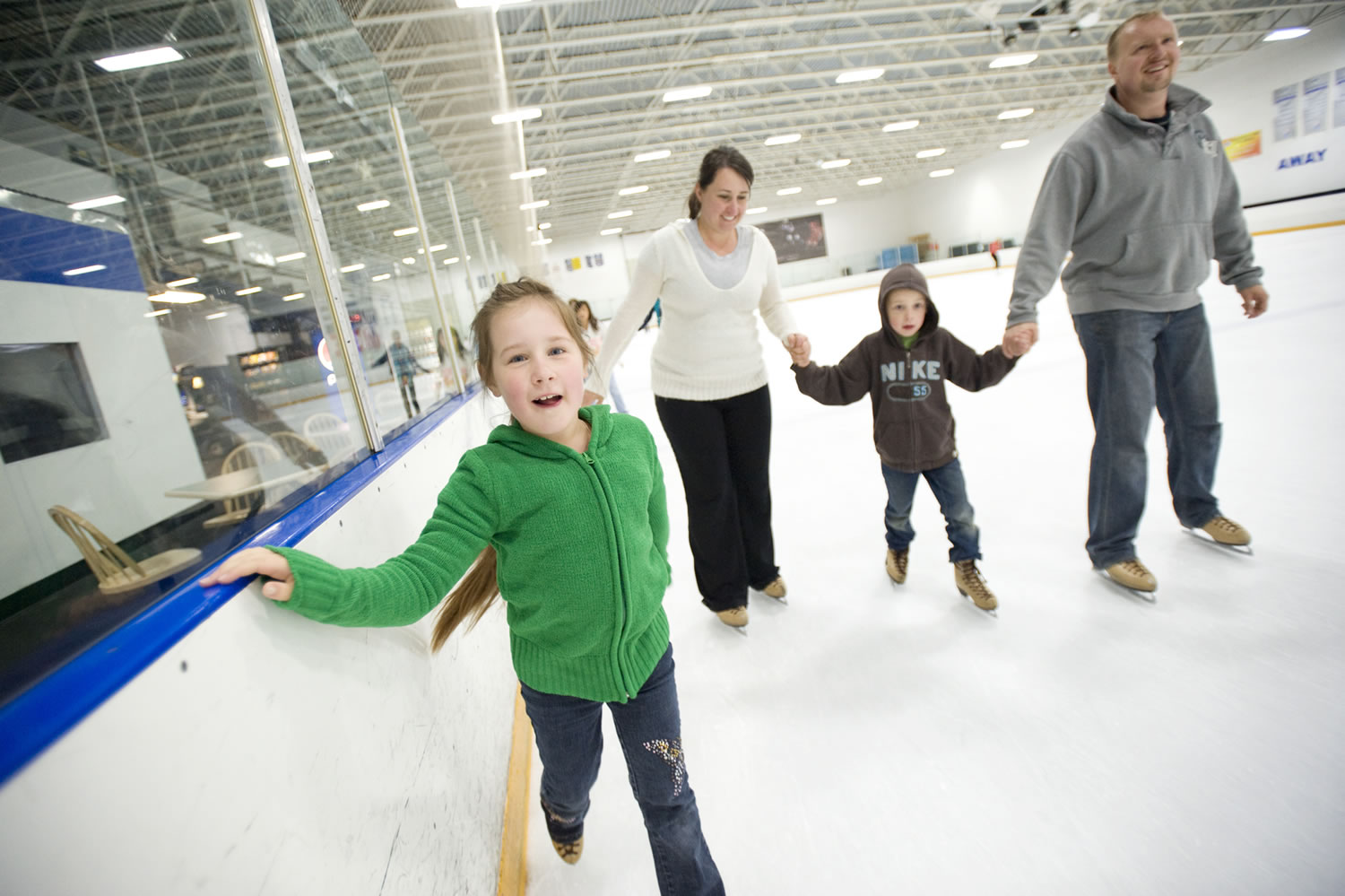 The Yamov family, from left, Christina, 7, Yuliya, Max, 5, and Nick skate at the Mountain View Ice Arena.