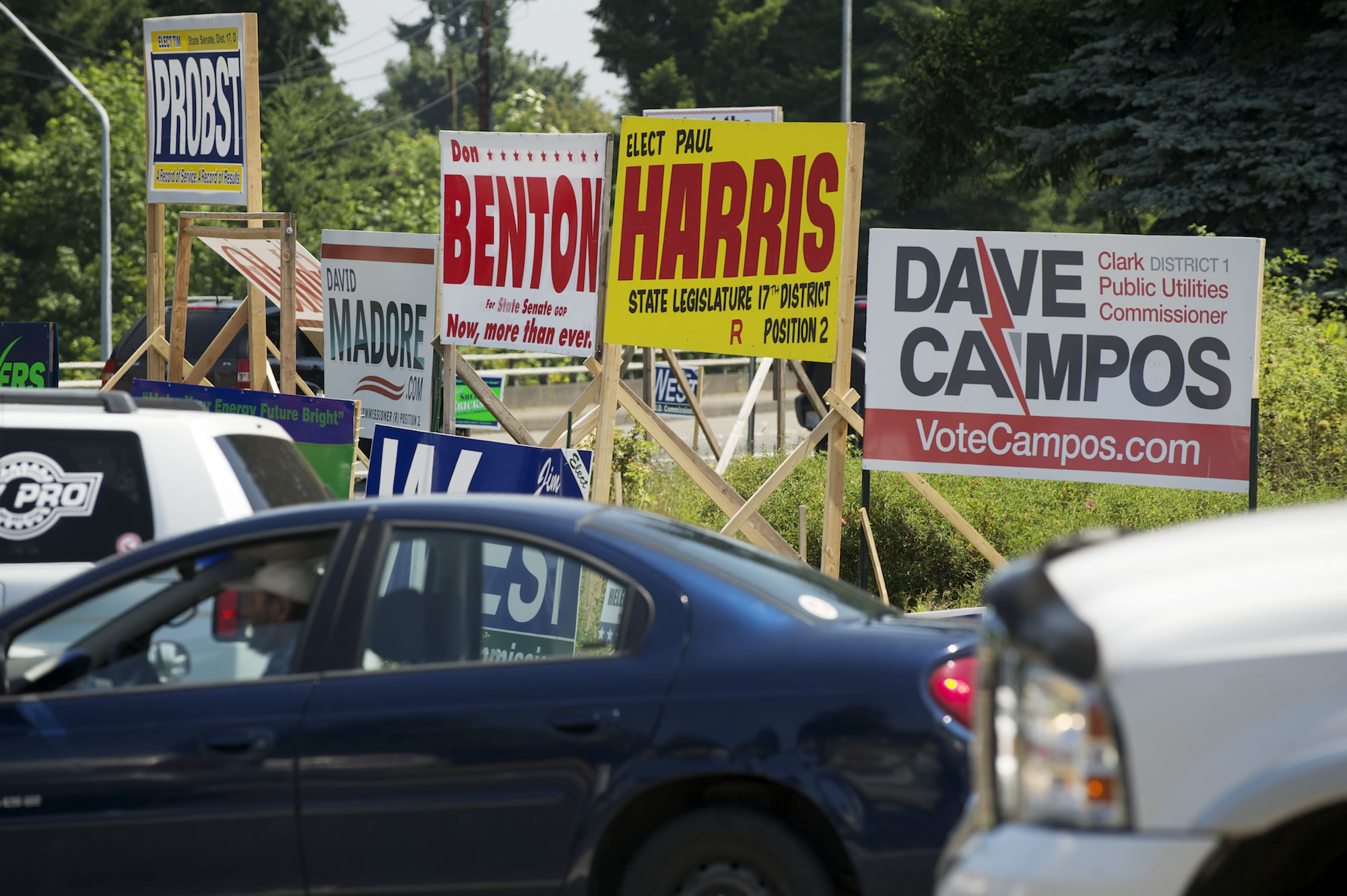 Midday traffic passes political campaign sign at the intersection of 134th Street and Highway 99.